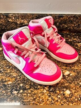 Nike Air Jordan 1 mid fierce pink 
Size: 4.5 Youth / Women’s 6
Barbie Air Jordan